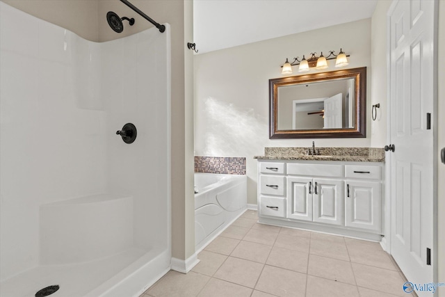 bathroom with vanity, independent shower and bath, and tile patterned flooring