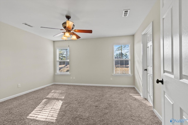 empty room featuring light colored carpet and ceiling fan