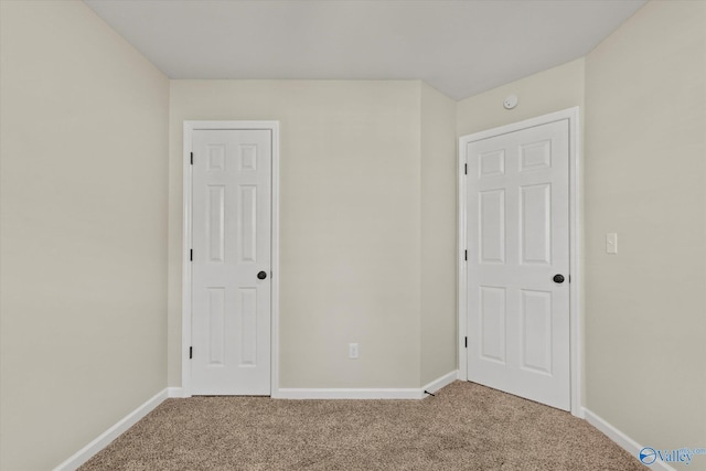 unfurnished bedroom with carpet