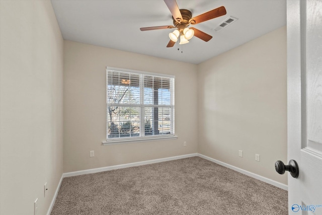 spare room with ceiling fan and carpet flooring