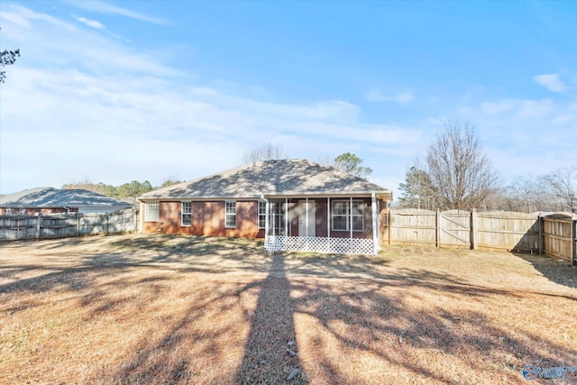 rear view of house with a sunroom