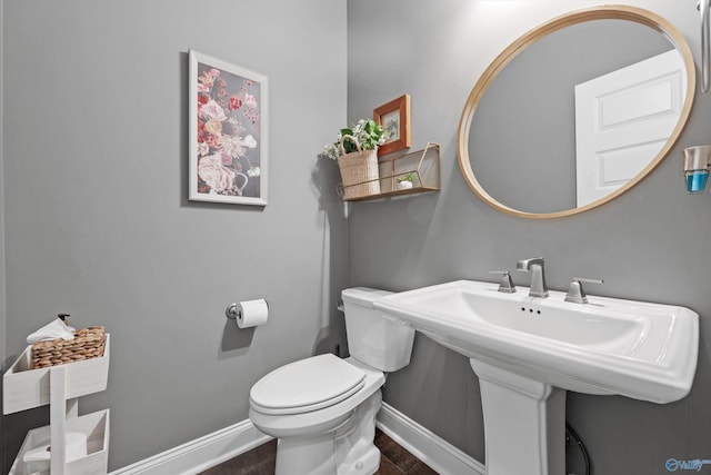 7531 Hadleigh Crst, Owens Cross Roads, AL 35763 - half bath featuring toilet, baseboards, and wood finished floors