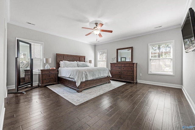 7531 Hadleigh Crst, Owens Cross Roads, AL 35763 - bedroom with dark wood-type flooring, multiple windows, baseboards, ceiling fan, and crown molding