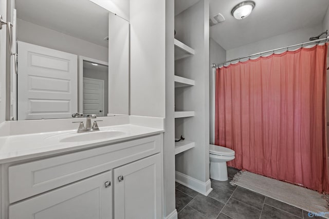7531 Hadleigh Crst, Owens Cross Roads, AL 35763 - full bathroom featuring toilet, vanity, tile patterned flooring, and a shower with shower curtain
