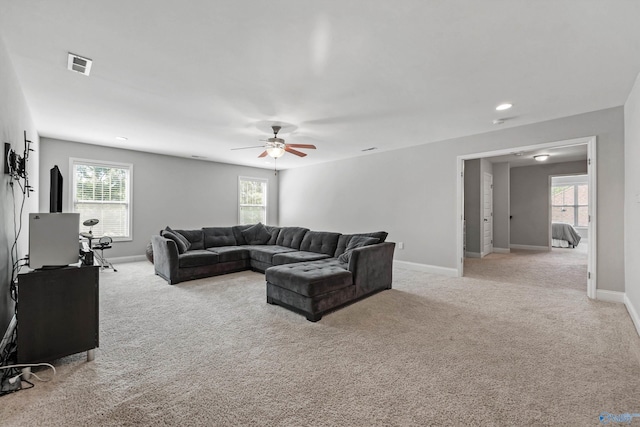 7531 Hadleigh Crst, Owens Cross Roads, AL 35763 - living area with light carpet, ceiling fan, and plenty of natural light