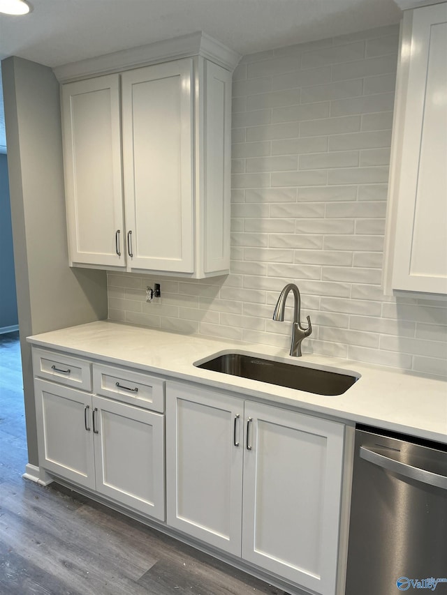 2385 Cedar Ridge Cir, Hokes Bluff, AL 35903 - kitchen with dishwasher, light countertops, backsplash, and wood finished floors