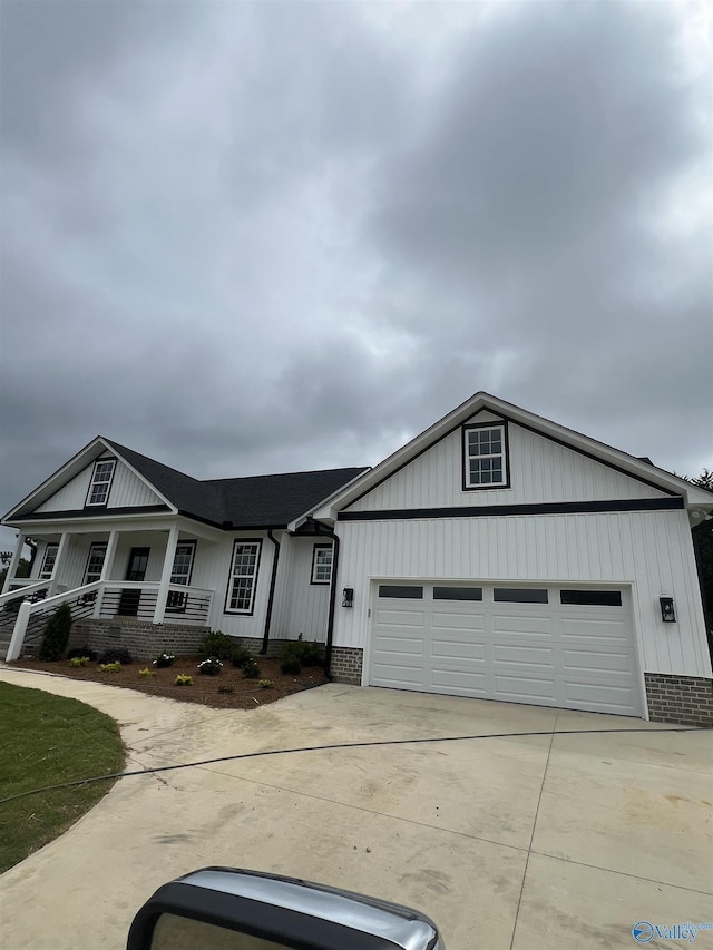 2385 Cedar Ridge Cir, Hokes Bluff, AL 35903 - view of front of property featuring concrete driveway, an attached garage, and a porch
