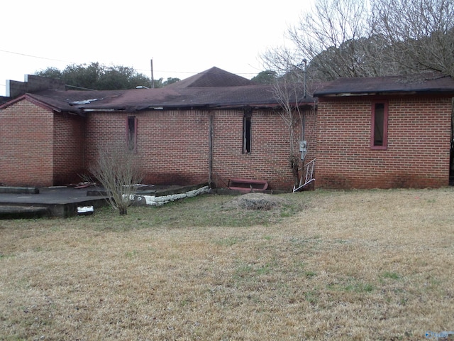 view of side of property with a yard