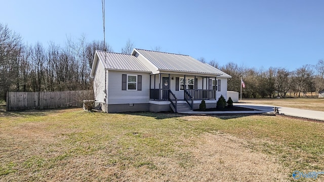 view of front of property with a front yard and covered porch