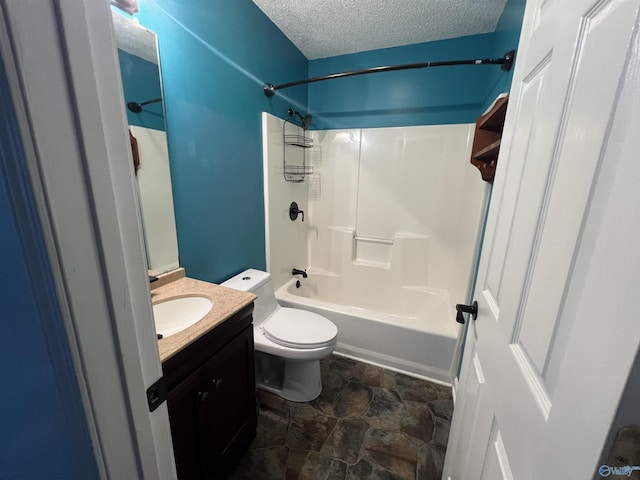 full bathroom with vanity, toilet, shower / bathing tub combination, and a textured ceiling