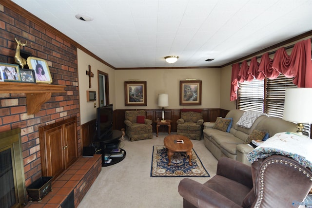 living room featuring a wainscoted wall, carpet flooring, a wood stove, and crown molding