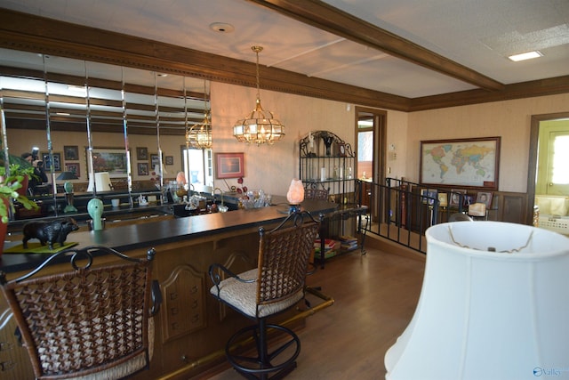 bar with beam ceiling, decorative light fixtures, and dark wood-style flooring