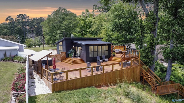 732 Bluff Dr, Rogersville, AL 35652 - back of house featuring a wooden deck, outdoor lounge area, a lawn, and stairway
