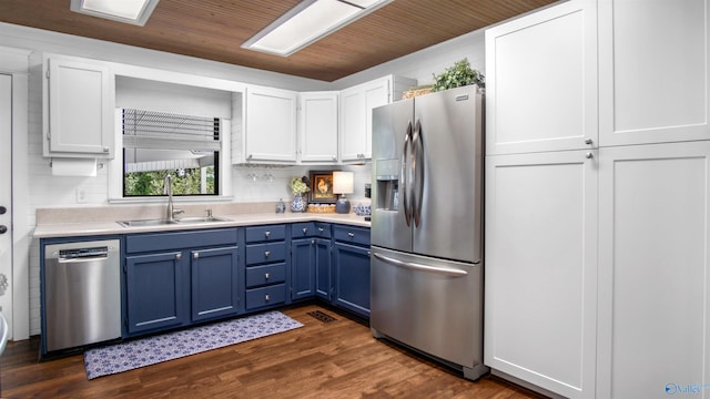 732 Bluff Dr, Rogersville, AL 35652 - kitchen with stainless steel appliances, a sink, blue cabinetry, and light countertops