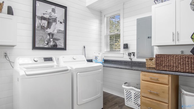 732 Bluff Dr, Rogersville, AL 35652 - laundry area featuring wooden walls, electric panel, washing machine and clothes dryer, cabinet space, and dark wood-style flooring