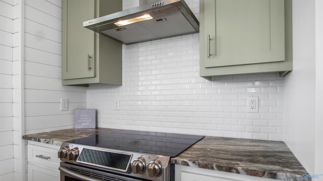 732 Bluff Dr, Rogersville, AL 35652 - kitchen featuring exhaust hood, stainless steel range with electric cooktop, tasteful backsplash, and green cabinets