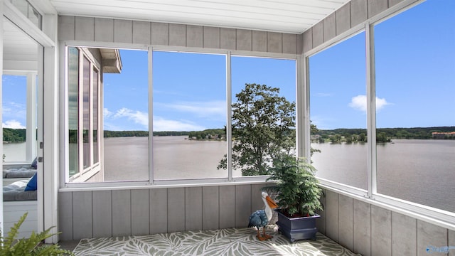 732 Bluff Dr, Rogersville, AL 35652 - unfurnished sunroom with a water view and wood walls