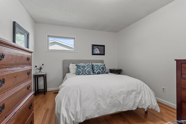 1308 Aston St, Athens, AL 35611 - bedroom with baseboards and light wood-style flooring