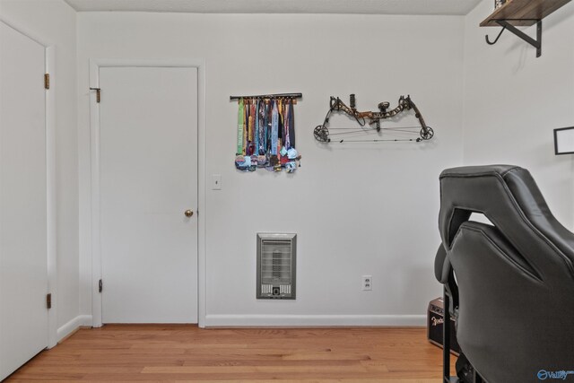 1308 Aston St, Athens, AL 35611 - home office with light wood-style floors, heating unit, and baseboards