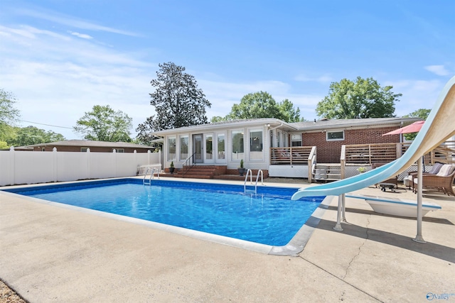 1308 Aston St, Athens, AL 35611 - view of pool with fence, a deck, a fenced in pool, a patio area, and a water slide