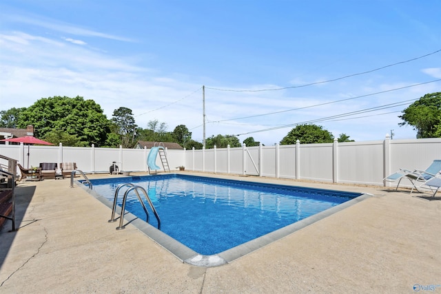 1308 Aston St, Athens, AL 35611 - view of swimming pool with a patio, a water slide, a fenced backyard, and a fenced in pool