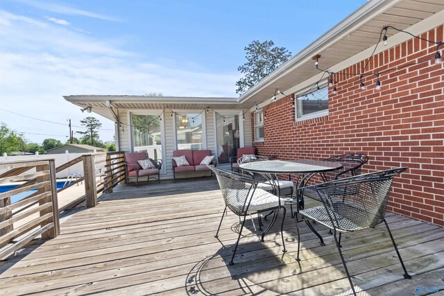 1308 Aston St, Athens, AL 35611 - wooden terrace with an outdoor living space and outdoor dining area