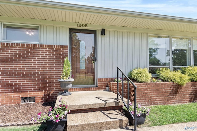 1308 Aston St, Athens, AL 35611 - view of exterior entry featuring brick siding and crawl space