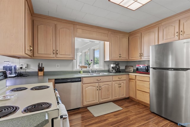 1308 Aston St, Athens, AL 35611 - kitchen with light brown cabinetry, appliances with stainless steel finishes, a sink, and dark wood-type flooring