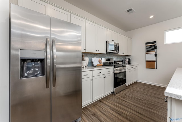 166 Mill Valley Way, New Market, AL 35761 - kitchen featuring stainless steel appliances, visible vents, dark wood finished floors, backsplash, and white cabinets