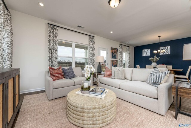 166 Mill Valley Way, New Market, AL 35761 - living room with visible vents, an inviting chandelier, recessed lighting, and wood finished floors