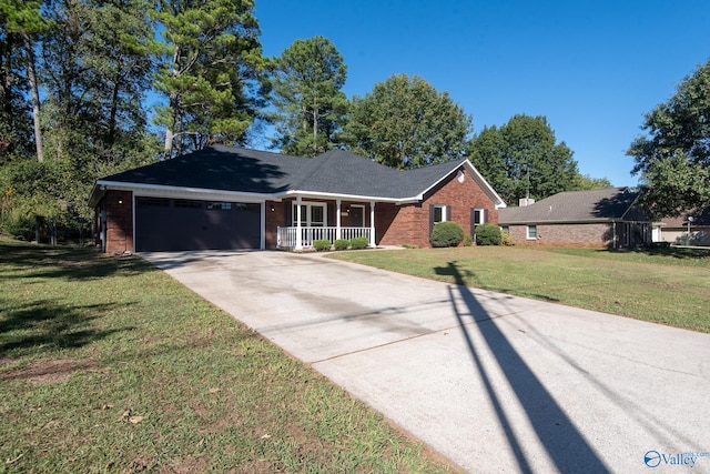 ranch-style house with a garage, a porch, and a front lawn