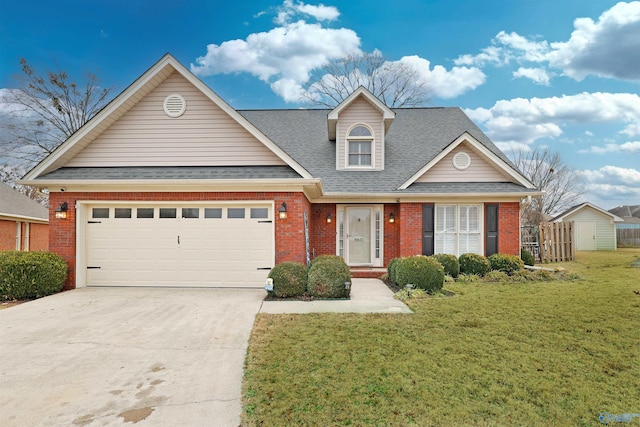 view of front of property featuring a garage and a front lawn