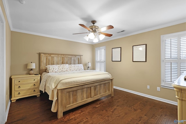 bedroom with dark wood-type flooring, baseboards, visible vents, and ornamental molding