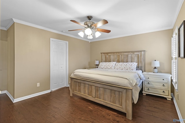 bedroom featuring dark wood-type flooring, crown molding, and baseboards
