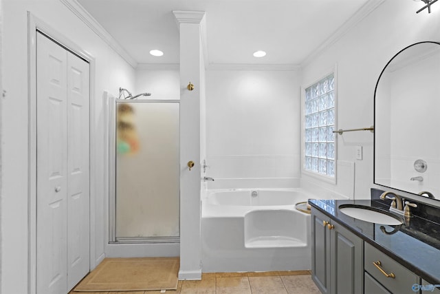 bathroom with a closet, a stall shower, and tile patterned flooring