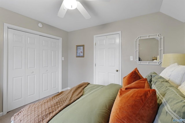 carpeted bedroom featuring a closet, ceiling fan, and vaulted ceiling