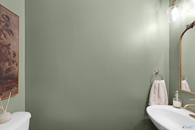 bathroom featuring toilet and a sink