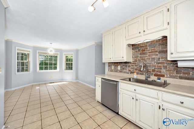 kitchen featuring light tile patterned flooring, decorative light fixtures, dishwasher, sink, and decorative backsplash