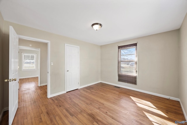 spare room featuring hardwood / wood-style flooring