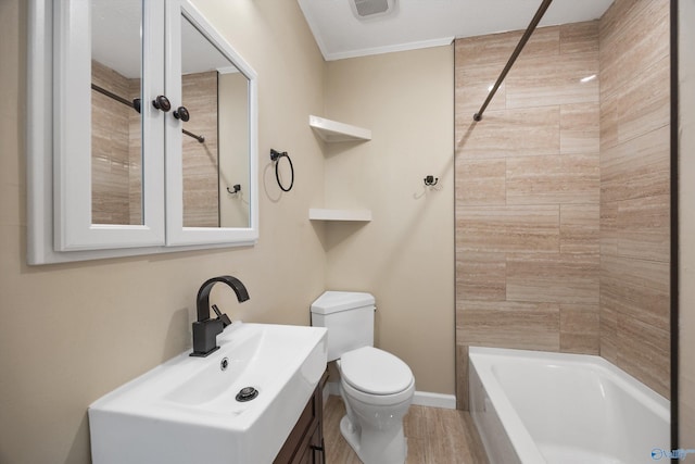 full bathroom with sink, wood-type flooring, toilet, and tiled shower / bath