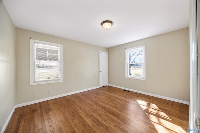 empty room featuring hardwood / wood-style floors