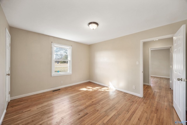 unfurnished room featuring light hardwood / wood-style flooring