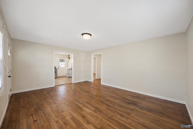 spare room featuring dark hardwood / wood-style floors