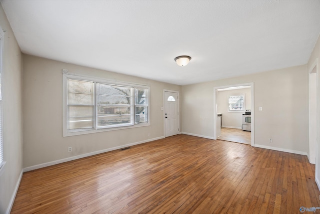 empty room featuring hardwood / wood-style flooring