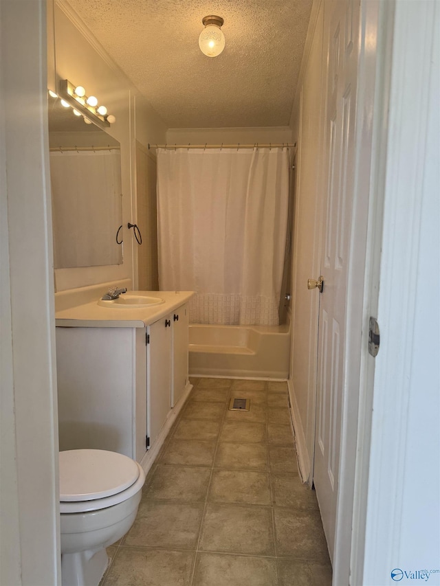 bathroom featuring tile patterned floors, shower / tub combo with curtain, toilet, a textured ceiling, and vanity