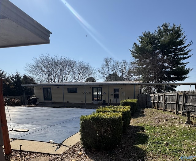 back of house with a patio area and fence