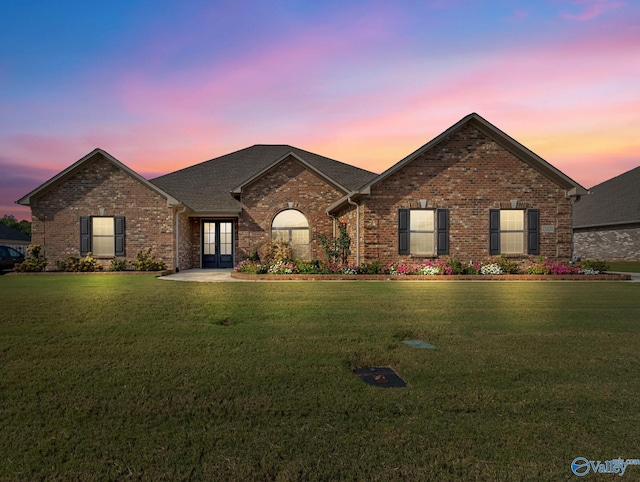 view of front of home with a lawn