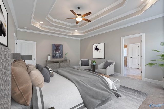 bedroom featuring a raised ceiling, ceiling fan, ornamental molding, and light colored carpet