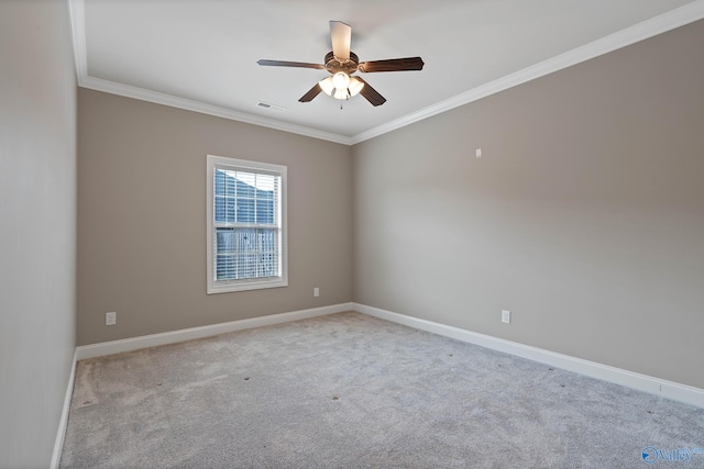 carpeted empty room featuring crown molding and ceiling fan