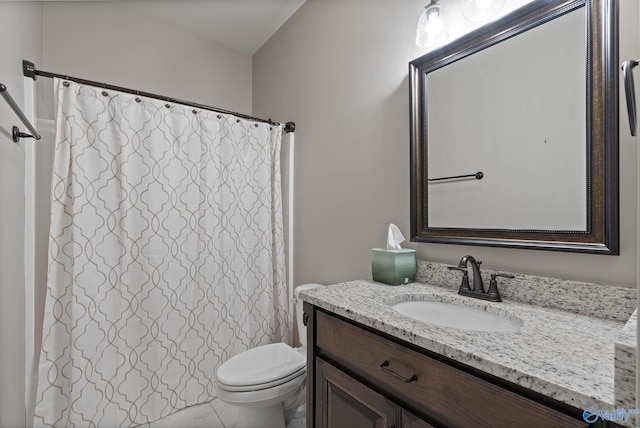 bathroom featuring vanity, toilet, and a shower with shower curtain